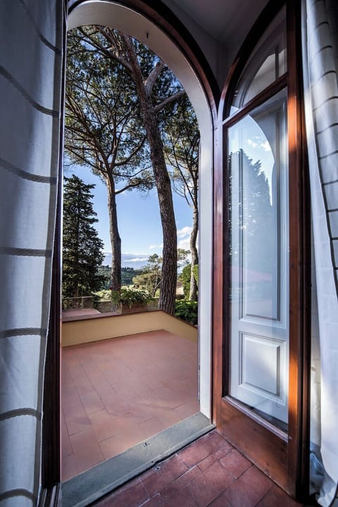 Main Living room's French door opening onto gazebo and lounge/dining area
