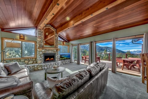 Welcome to the living room with spectacular views and cozy fireplace.