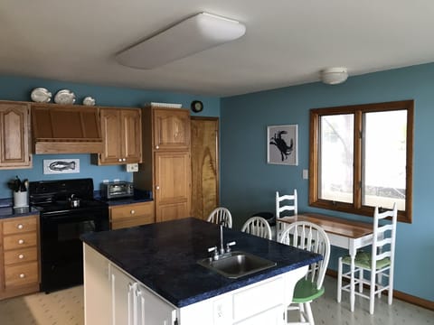Kitchen island and barstools. You can cook, eat and hang out.