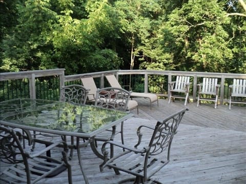 16' x 27 ' cedar deck with grill, glass table, and lounge chairs