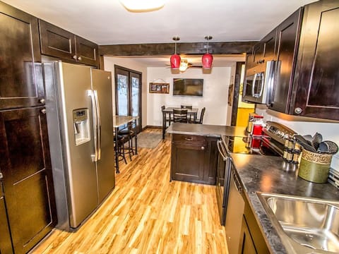Big fully-stocked kitchen with stainless appliances