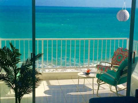 Enjoy the surf on your private balcony right on the beach!