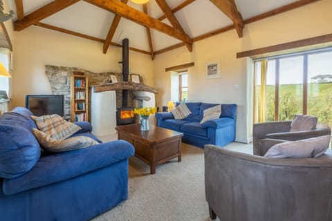 Spring Barn, Rock. First floor: Sitting room with feature fireplace and wood burning stove
