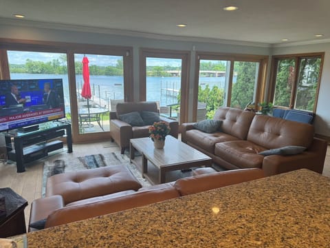 NEW LEATHER FURNITURE & AREA RUG, TV , 60” and COFFEE TABLE