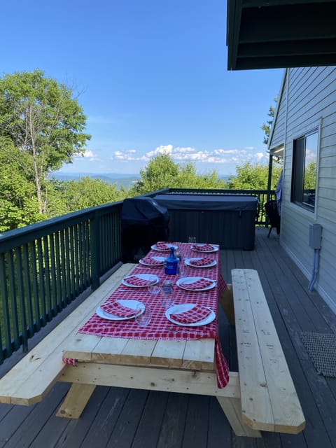 Picnic table and jacuzzi on deck for celebrations
