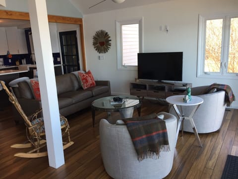 Living area with sliding doors out to deck.