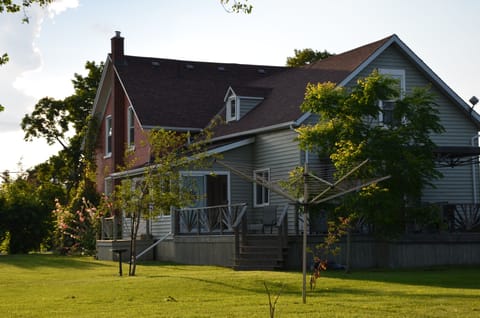 Large century farmhouse with wrap around veranda.