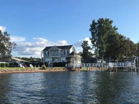 Water view of the home, yard and dock