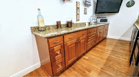 Wet bar with tons of storage,bar glasses in the cabinets,microwave and T.V.