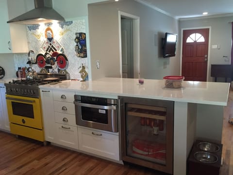 Newly remodeled kitchen with custom backsplash and Italian stove.