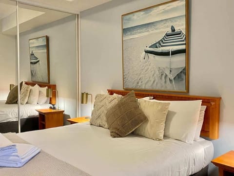 "Relax in style with a cozy, serene retreat featuring beach-inspired decor and comfort."