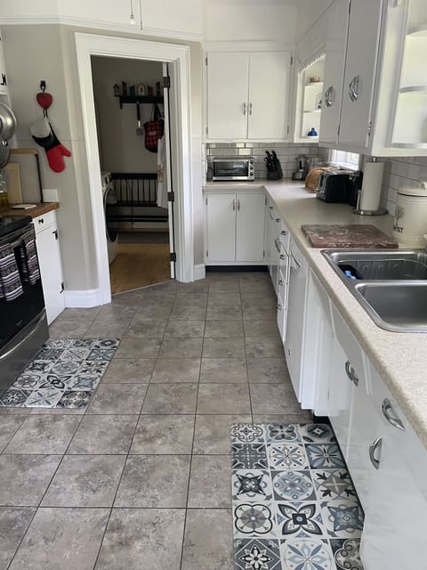 Kitchen, with doorway to master bedroom 
