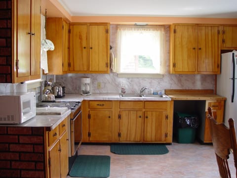 Full kitchen with jennair stove, fridge, microwave, toaster , all utensils etc.