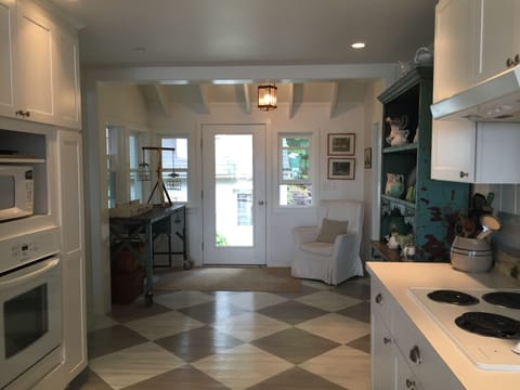 Kitchen, looking back to garden and entrance. 