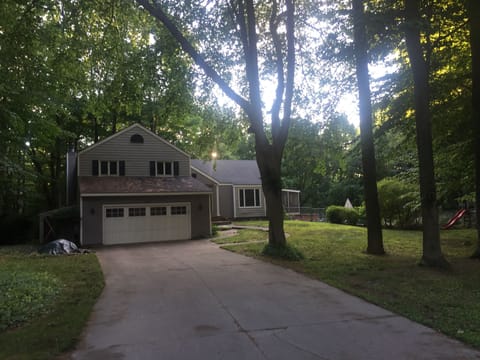 Home on end of cul-du-sac on heavily wooded lot with deep ravine and creek.