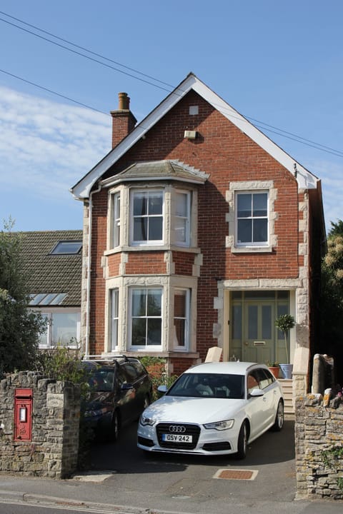 Front of house- with parking for 2 cars