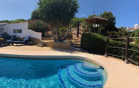 The pool, gardens & pergola have views over Javea Port and the Mediterranean Sea