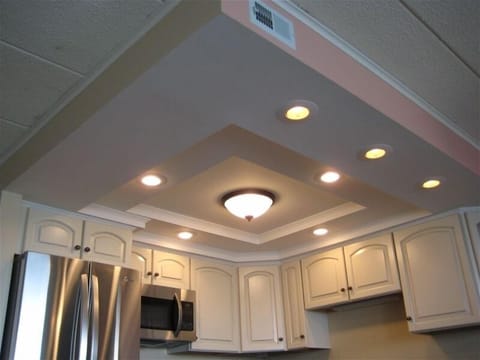 Tray ceiling and plenty of light in the kitchen.