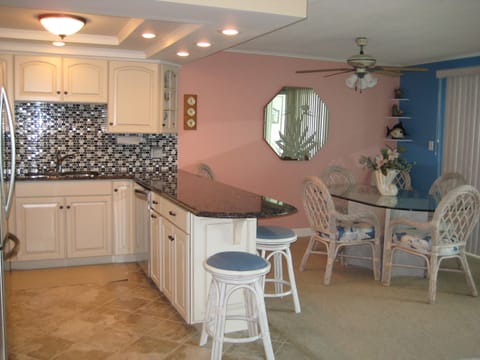 Peninsula with two bar stools