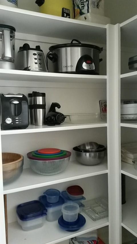 A fully equipped with pots/pans/blender/crockpot/toaster/baking wear/blender