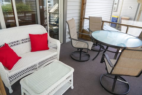 The screened-in patio offers conventient outdoor dining just off the kitchen