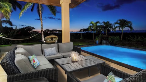 In the evening, the pool glows against the night sky