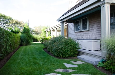 Side yard with path from parking space to side entry door