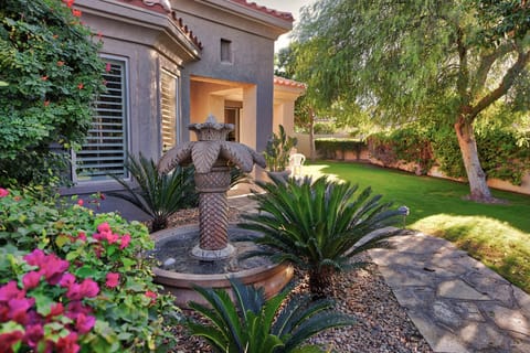 The tropical fountain and front yard await your arrival!