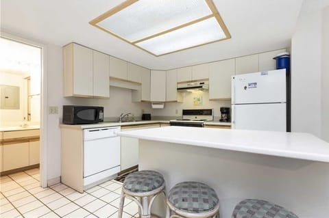 Fully equipped kitchen has a mix of new and original appliances.