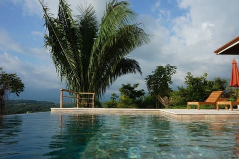 View from the infinity pool sunken bench, the mountains in the distance 