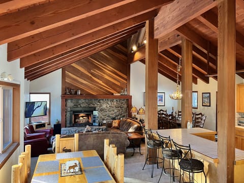 Large light Great Room with 4 areas: bonus table area, living, dining, kitchen