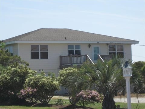 Parking area and street side view of house