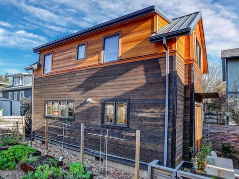 cottage is newly constructed in a quiet side yard alongside gardens & courtyar