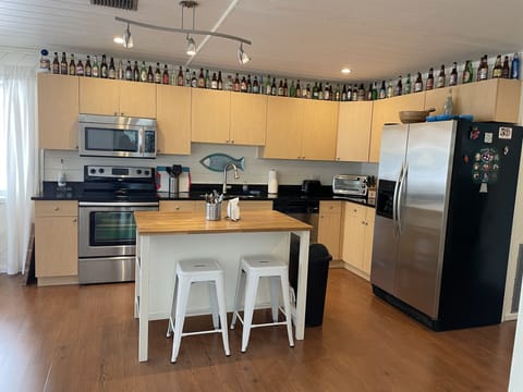 Kitchen with island and stainless appliances