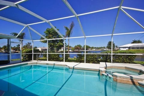 Heated pool and spa with beautiful view of wide intersecting canals!