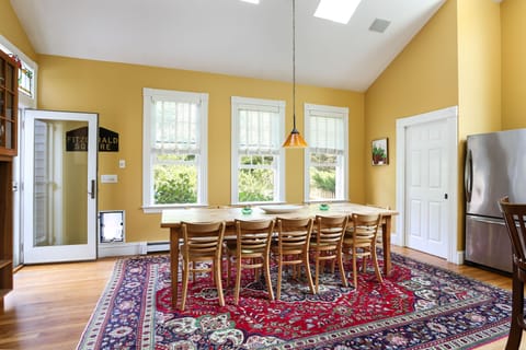 The cavernous kitchen's long French country farm table seats 12 or more 