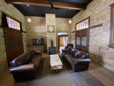 relax, watch tv and at night pull down the 2 antique Murphy beds to sleep 