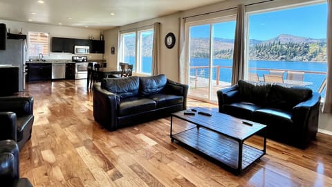 Beautiful views of Lake Chelan from the wall of windows in the kitchen, living, and dining areas