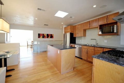 DR leads to eat-in kitchen with skylight, direct garden access