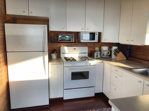 Newly renovated kitchen with solid surface countertops