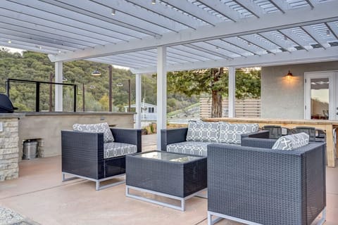 Outdoor living room: seating area & 12 ft. teak dining table.