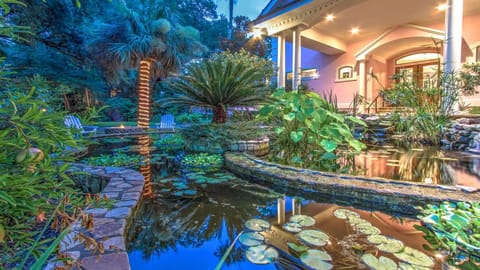 Home has 2 Koi Ponds in Front Yard