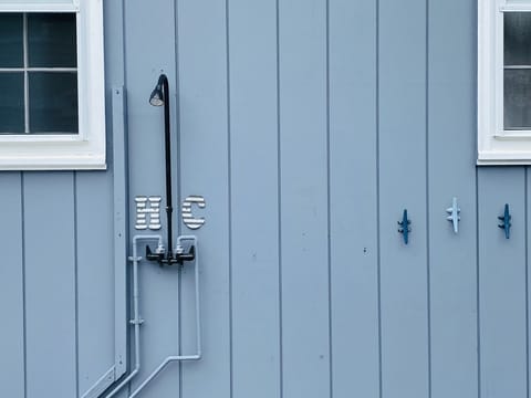 Outdoor shower with hot and cold water
