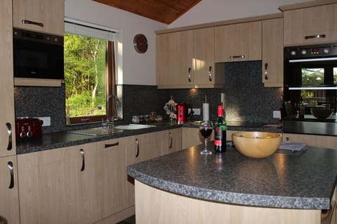 The well equipped, open plan kitchen with views over the garden.
