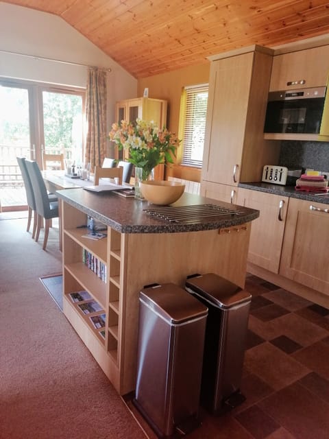 Kitchen and dining area with views over the pond. 