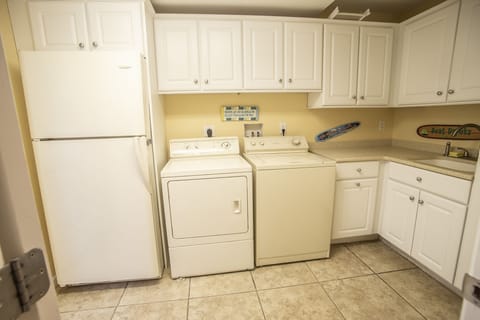 Pool house - entrance from pool area. Washer/dryer and additional fridge