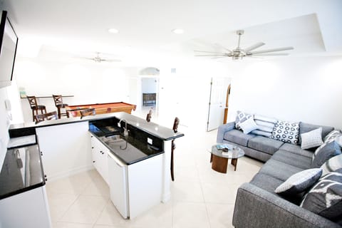 Entertainment area with pool table and bar, not to mention comfortable couch.