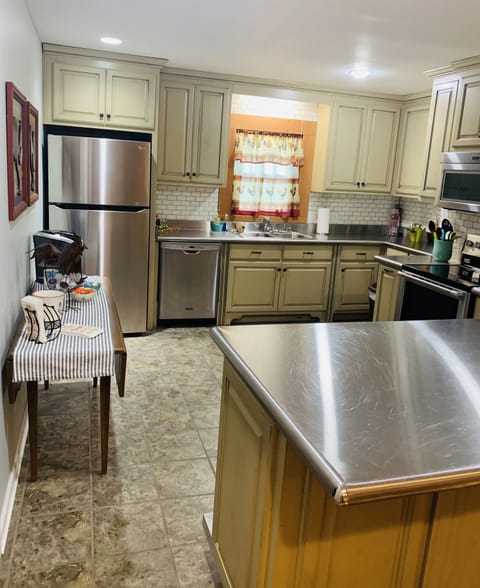 Spacious kitchen with stainless countertops. Fully equipped for cooking. Keurig.