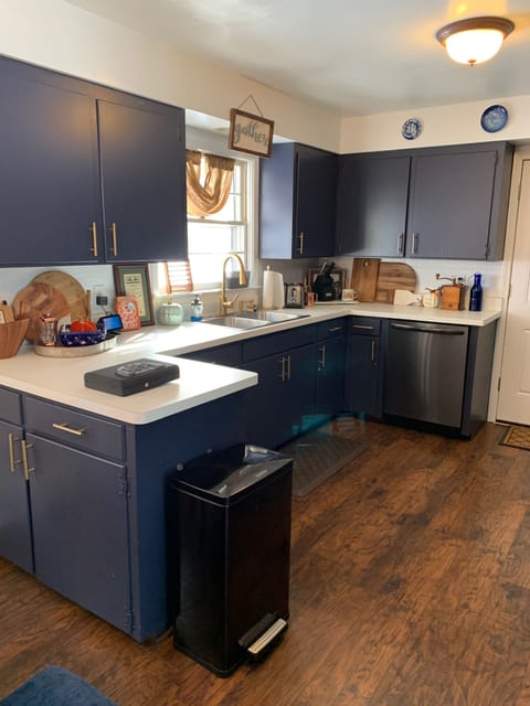 Kitchen with new appliances including 5 burner stove, ice maker and dishwasher.