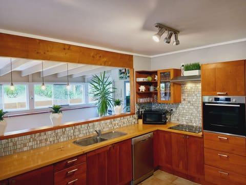 Fully equipped open plan kitchen with top of the range appliances